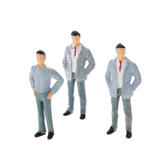 PEOPLE STANDING MODEL TRAIN LAYOUT